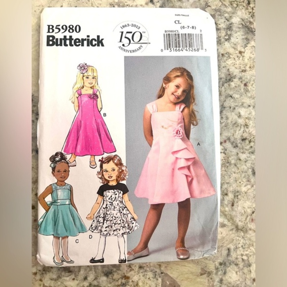 Butterick‎ B5980 girls dress uncut pattern four different dresses.